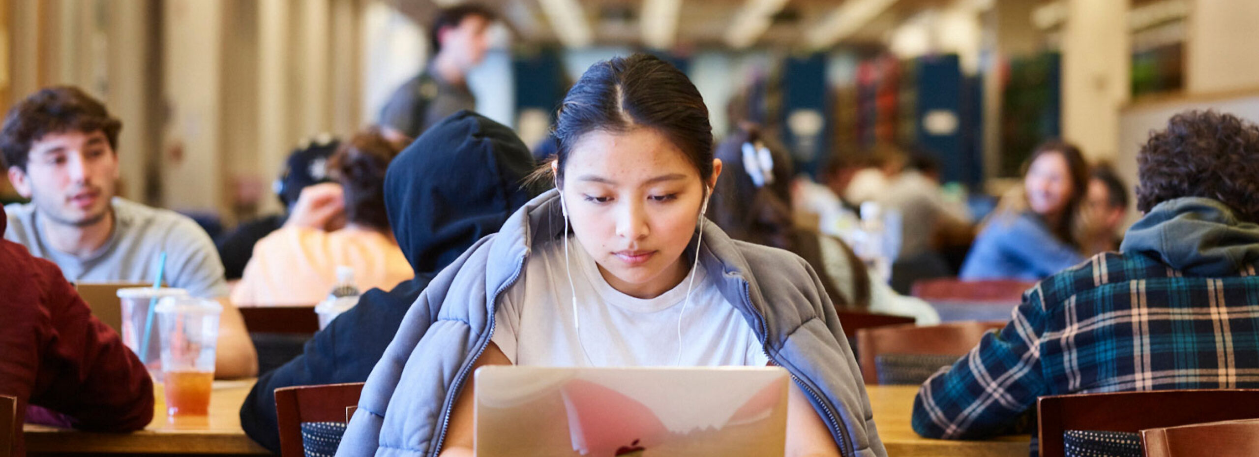 Students studying together in a campus dining hall